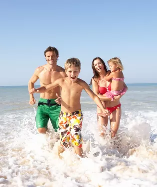 Family on sandy beach